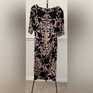 Connected Apparel Blue/Tan pattern dress, mid length sleeves
Size 14